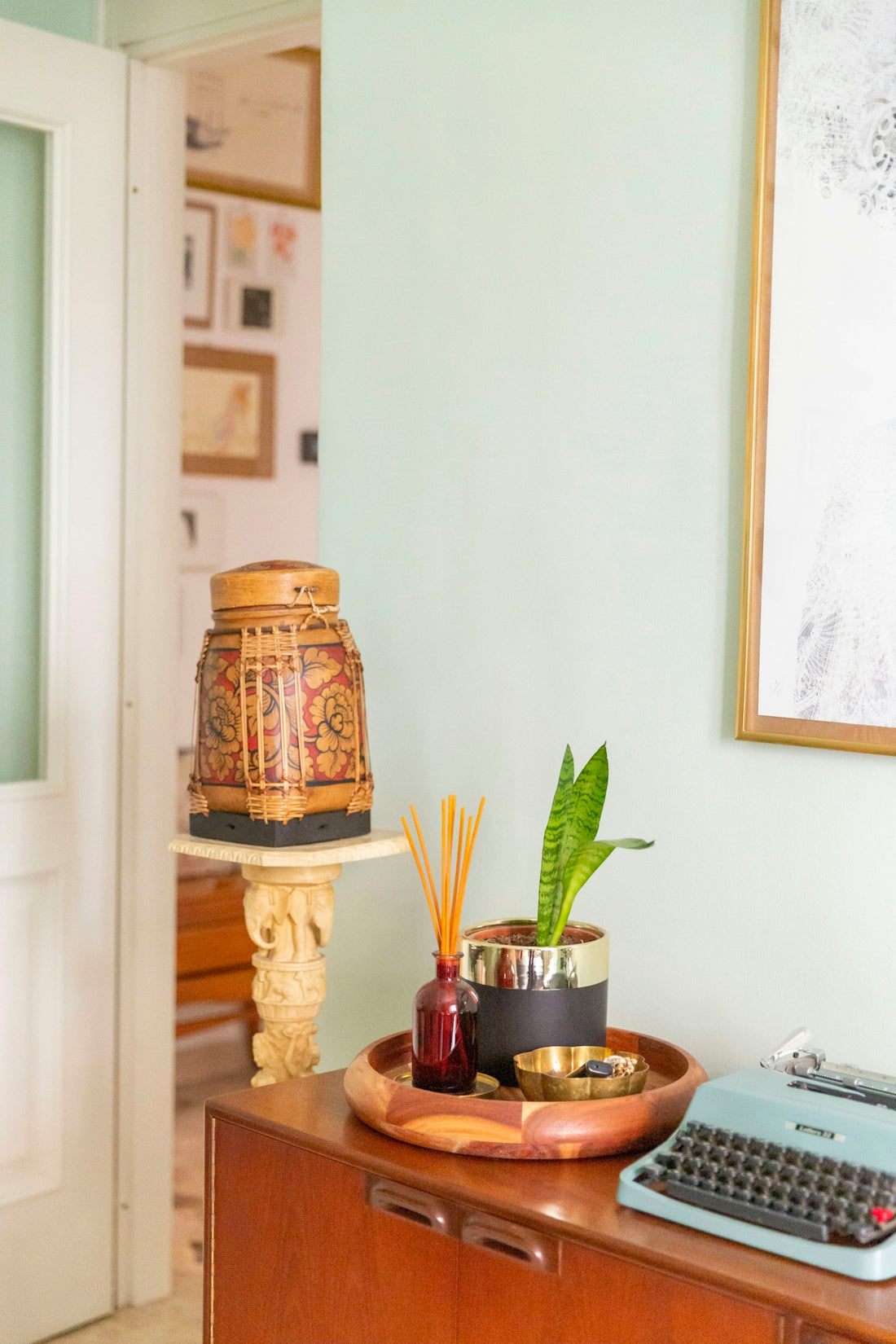 brown and white ceramic jar on brown wooden table