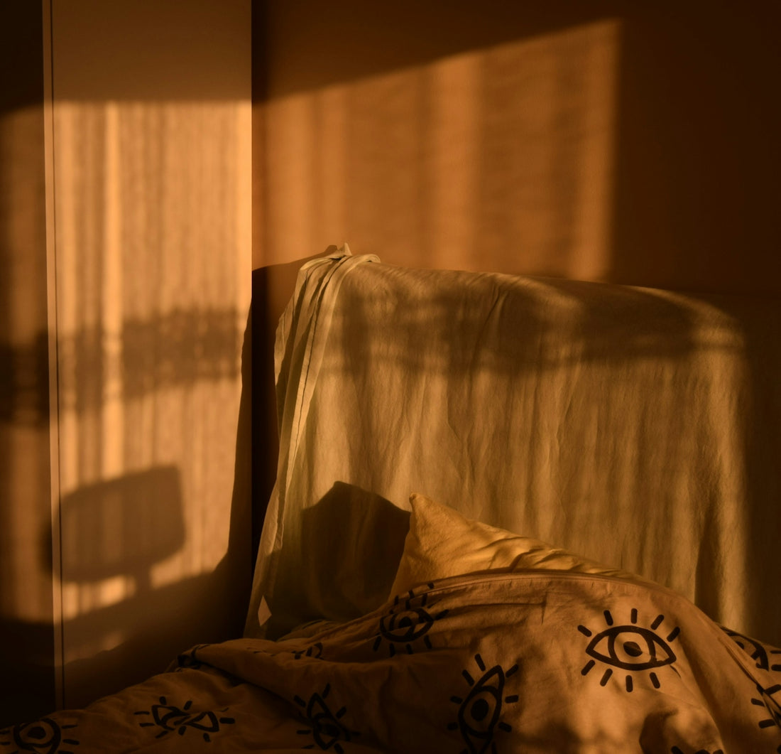 Warm sunlight streams into a corner bedroom.