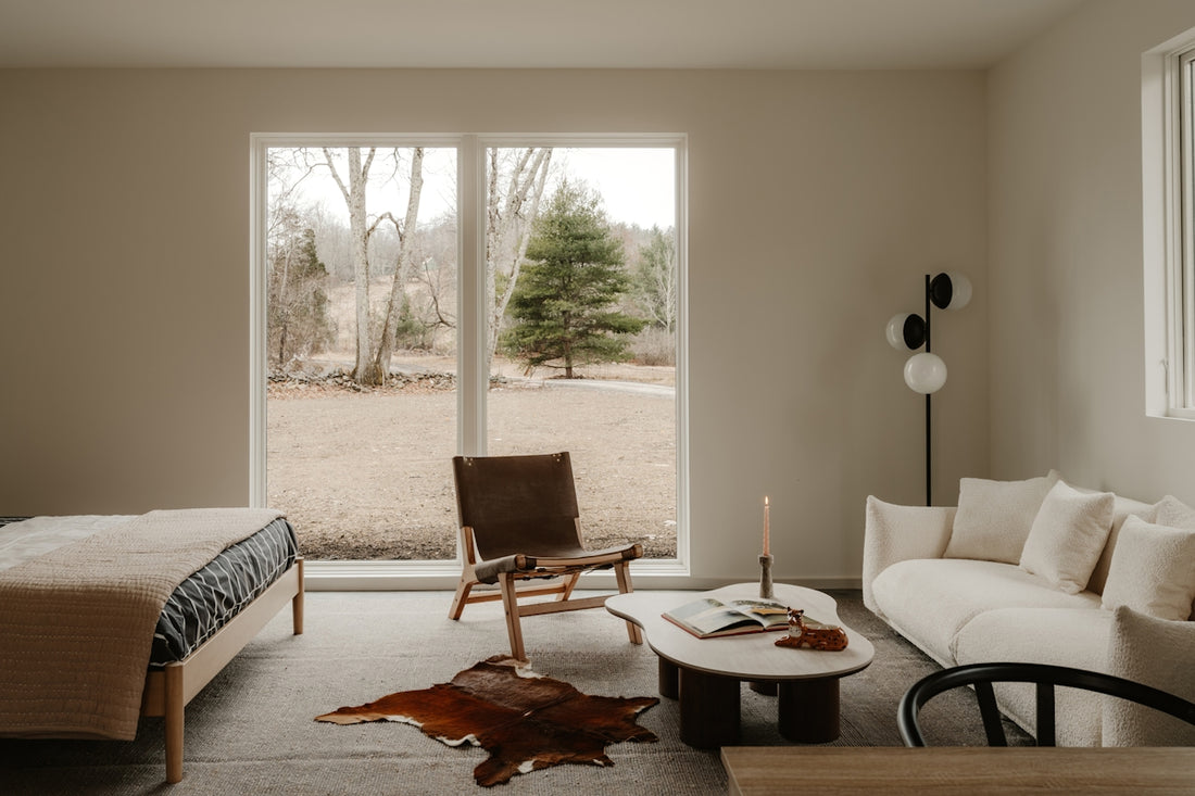 Modern living space with large window overlooking nature