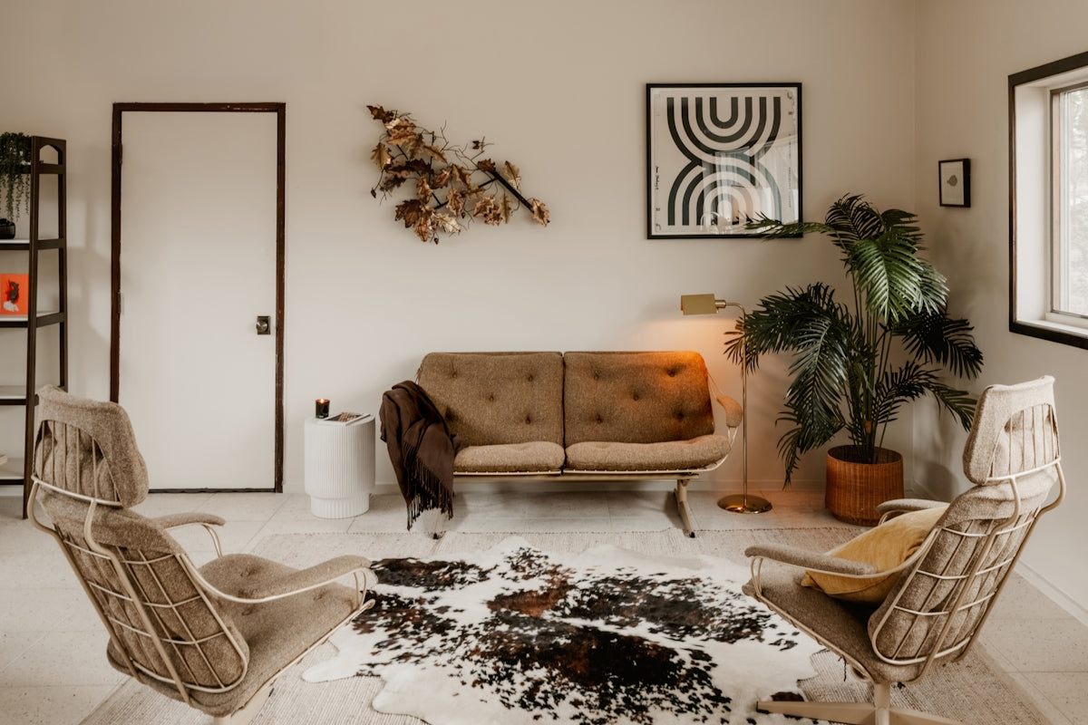 Bohemian living room with two chairs and sofa